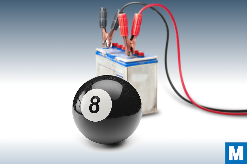 A black 8-ball in front of a car battery