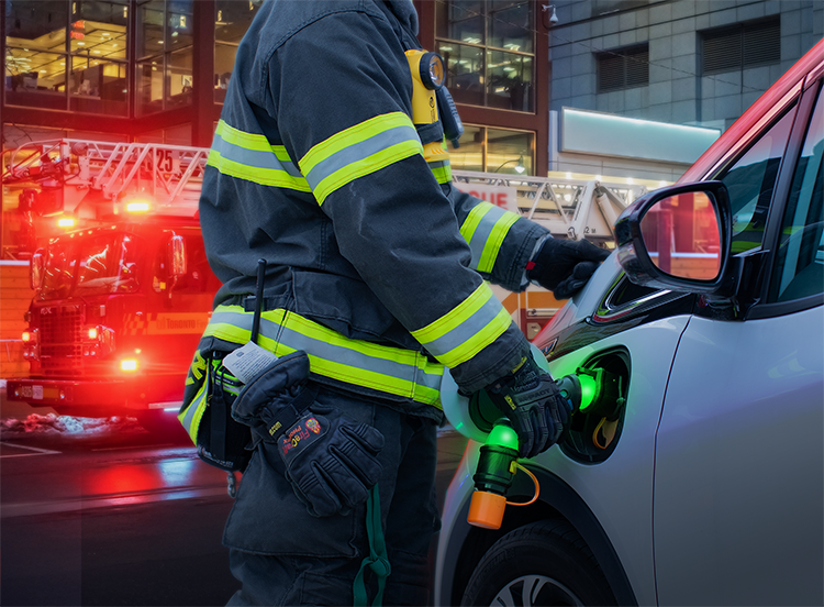 “`json { “alt”: “Firefighter in reflective gear inspecting a charging electric vehicle on a city street at night.”, “title”: “Firefighter Inspecting Electric Vehicle” } “` ```json { "alt": "Firefighter in reflective gear inspecting a charging electric vehicle on a city street at night.", "title": "Firefighter Inspecting Electric Vehicle" } ```